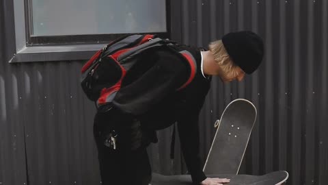 man balancing skateboard