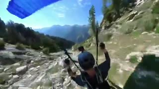 Paraglider Flies and Flips Over Rocks