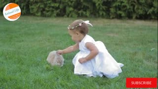 Little Girl Playing With Rabbit