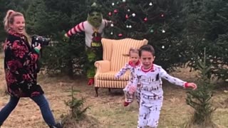 Screaming kids run in fear from 'Grinch' photoshoot prank