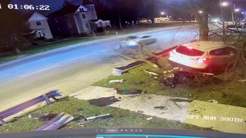 Out of Control Car Lands on Tree in Front Yard