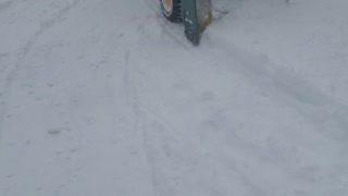 9 year old handles snowblower