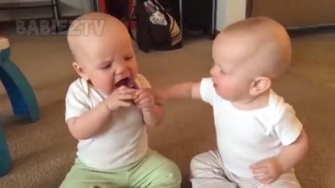 funny baby girl fighting with boy