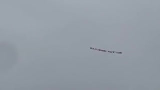 "Let's Go Brandon" Banner flying over Trump's Rally