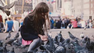 Girl feeding birds