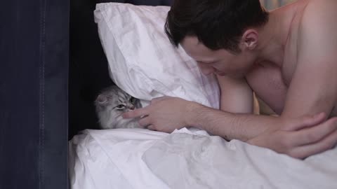 Man Showing Love For His Cat