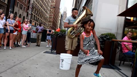 Talented little girl dances along to live jazz performance
