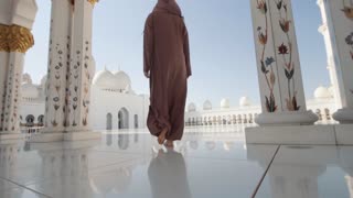 Woman in Hijab Walking at Mosque