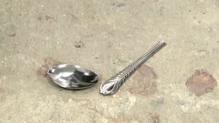 Uri Geller performs spoon trick during vaccination