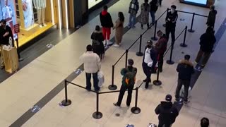Nike store line at Toronto's Eaton Centre on reopening day