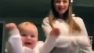 A baby girl dancing with her mother 😜😜
