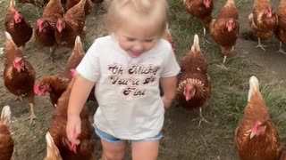 Adorable Little Girl And Her Army Of Chickens