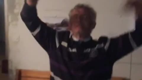 Old man dancing to party music