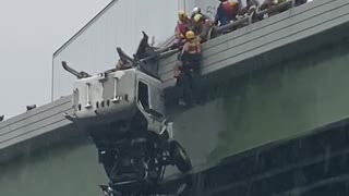 Driver Rescued From Truck Dangling off Bridge