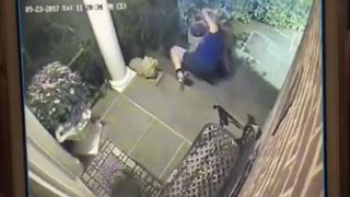 Security camera, woman falls down front porch stairs