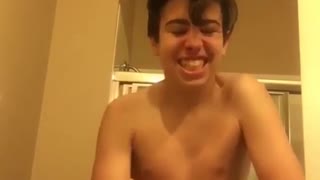 Shirtless kid super saiyan screaming bathroom