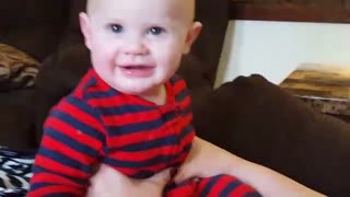 Little Boy Scowls While Dad Sings Christmas Hymn