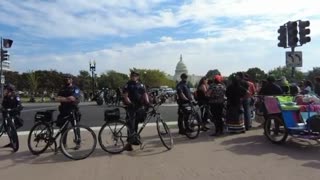Police arrest the last of the youth climate protestors that took over an intersection by the Capitol building