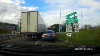 Tractor trailer squeezes through and damages signs