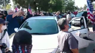 Woman drives through crowd of Trump supporters as they clash with BLM protesters