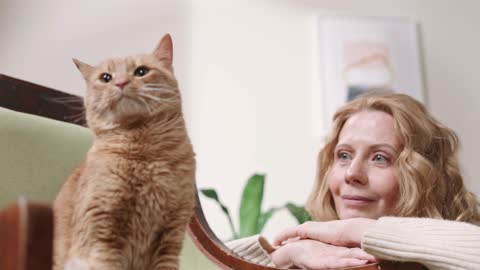 A Woman Adoring Her Cat at home