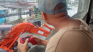 Construction Worker Uses Gaming Controller for Work