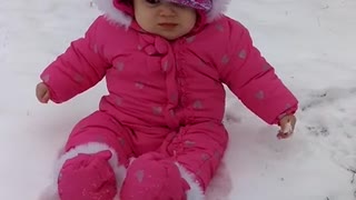 Baby experiences snow for the first time, has priceless reaction