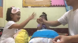 Daughters Play a Whimsical Game of Rock, Paper, Scissors With their Father