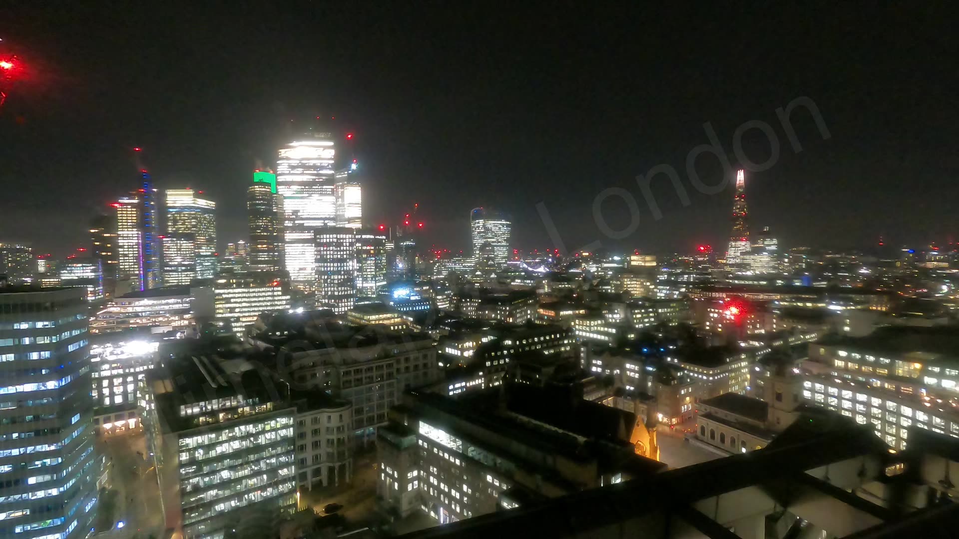 The City and The Shard at night with rolling clouds