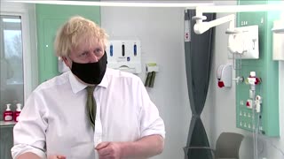 Britain's Johnson visits hospital as Oxford vaccine rollout begins