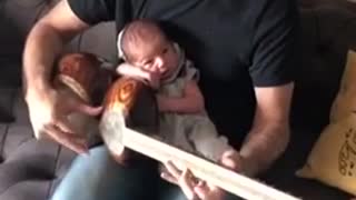 2-Week-Old Baby Relaxes While Dad Jams Soothing Music