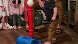 2 yr old has a unique way of hitting the ball