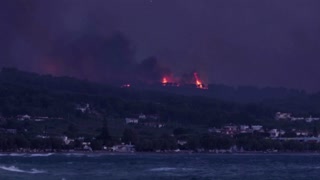 Greek firefighters battle overnight to contain blaze