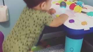Baby hilariously dances along to toy music