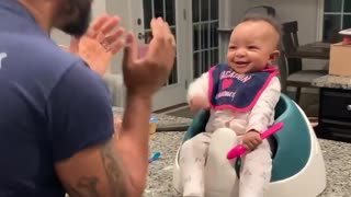 Sweet baby girl laughs at her dad's dance moves