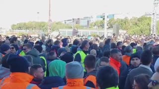 Thousands of people join Italian dock workers to protest against COVID passports in Italy.