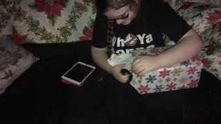 Daughter opening a gift