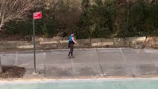 Woman dances down sidewalk in nyc