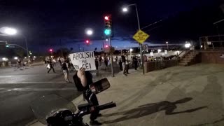 Protestors Mistake Man for Police Officer
