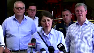 Australian prime minister tours flood zones