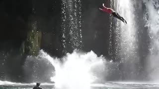 Tandem back flips from 40 foot waterfall in slow motion