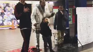 Little boy black jacket white microphone singing
