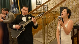 Bride And Groom Surprise Guests With Acoustic Performance