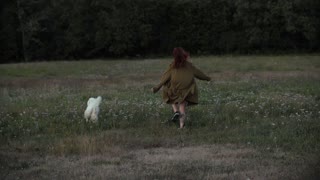 Woman Playing with Dog