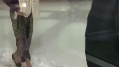 Man clears snow path so wife can walk