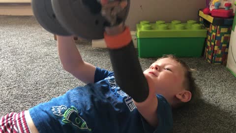Kid shows off his strength while using prosthetic arm