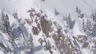 Professional Skier Front Flips From Massive Cliff