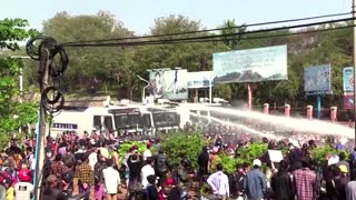 Myanmar police turn water cannon on protesters