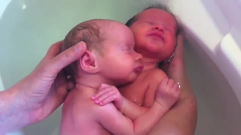 Newborn Twins Think They are Still in the Womb