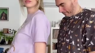 A pregnant wife dancing with husband